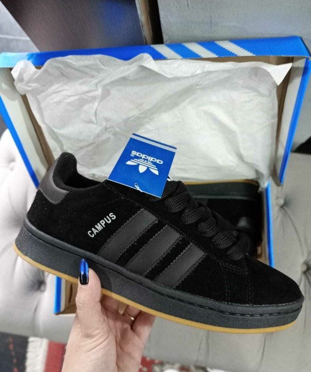 Adidas negras suela marron sale