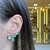 BRINCO EAR CUFF VERDE COM GOTA PENDURADA na internet