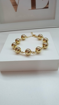 Pulseira de bolinhas lisas, em banho ouro 18k.