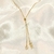 Colar Gravatinha com pingente de Menino e Coração cravejado em Zircônia Banhado em Ouro 18k na internet