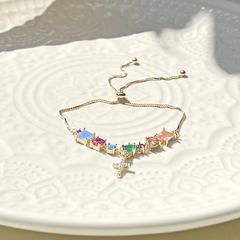 PULSEIRA COM CRUCIFIXO E PEDRAS FUSION COLORIDAS na internet