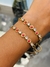 Pulsera de acero quirúrgico dorado con sol rojo - comprar online