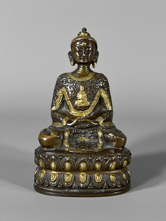Buda realizado en bronce policromado