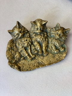 Depojador em bronze “gatos”
