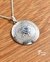 Medalla copo de nieve en plata con engarce de brillante color aguamarina