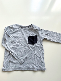 Remera Zara Bebe Manga Larga Gris Con Bolsillo Talle 12-18 M - comprar online