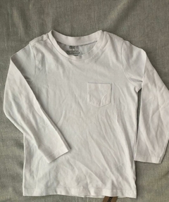 Remera manga larga H&M blanca con bolsillo unisex talle 1-2 años