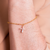 PULSEIRA COM PINGENTE DE CRUZ BANHADO EM OURO 18K - comprar online