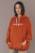 Buzo Hoodie Something Naranja Oscuro en internet