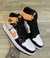 Air Jordan 1 Mid Preto/ Branco/ Laranja