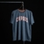 REMERA CUERDOS STREAM OSCURO MELANGE - comprar online