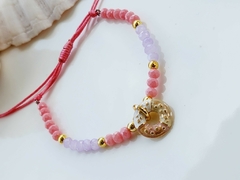 Pulseira de Cristais de Vidro Rosa e Lilás com Pingente Doce Rosquinha - na internet