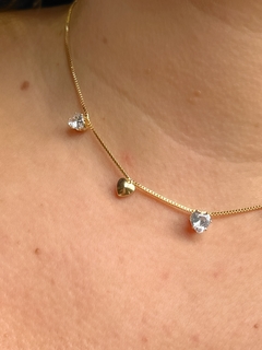 Chocker Melissa com pingentes de coração de zircônia e lisos banhado em ouro 18k na internet