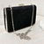 Clutch negro de mano y con cadena desmontable