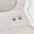 Argollas estrella strass color 1cm. Bronce bañado blanco en internet