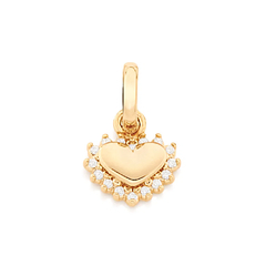 Dije corazón laminado en oro 18k con mini cristales.