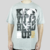 Camiseta cinza com estampa "KEEP YOUR HEAD UP" e imagem do rapper Tupac, tamanho XXL.