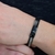 Bracelete Rosso Couro Preto e Aço - comprar online