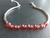 pulsera piedras rojas