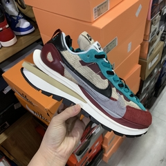 Sacai x Nike Vaporwaffle “Villain Red Neptune Green”