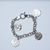 PULSERA PLATA ROLO CON DIJE SAN BENITO (NP0324) - comprar online