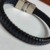 pulseira de couro sintético trançado preto com azul feche magnético