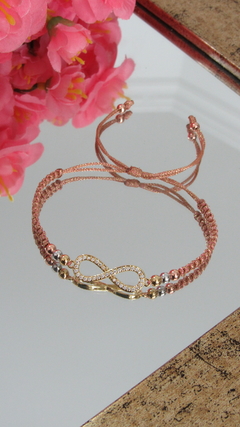 Pulsera infinito en dorado metalizado