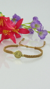 Pulsera san Benito pasante en dorado ocre