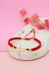 Pulsera cruz delgada roja