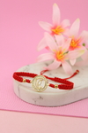 Pulsera silueta de virgen piedras en rojo