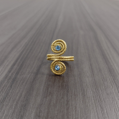 Anel Caracóis Capim Dourado 4mm com Strass Azul Claro. Código A22. na internet