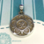 Medalla de Plata con Flor de Loto y OM en relieve - comprar online