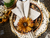 Porta guardanapo Gérbera (flor permanente) em argola de madeira na internet