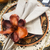 Porta guardanapo Magnólia marrom (flor permanente) em argola de madeira na internet