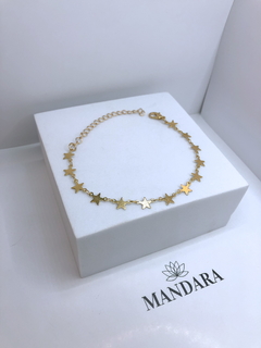 Pulseira de estrelinhas douradas