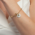 Pulseira madrepérola com trevo banhado em ouro 18k - comprar online