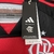 Etiqueta da camisa do Flamengo I 24/25 da Adidas, mostrando os logotipos da marca e do clube.