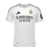 Camisa branca do Real Madrid I 24/25 para torcedores, com detalhes em preto e logo da Adidas.