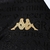 Detalhe da camiseta preta do Vasco da Gama III 23/24, com o logo da Kappa em dourado.