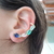 Brinco earcuff com cristais de zirconias e banho de ouro - comprar online