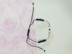 Pulsera de hilo negro tejido con bolitas acero blanco y dije de ojo turco