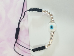 Pulsera de hilo negro tejido con bolitas acero blanco y dije de ojo turco - comprar online