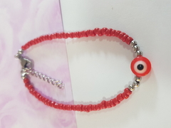 pulsera de mostacillas rojas con bolitas y dije ojo turco y terminal de ACERO QUIRÚRGICO