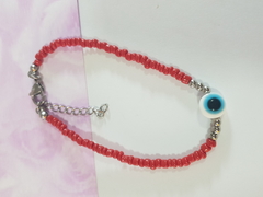 pulsera de mostacillas rojas con bolitas y dije ojo turco y terminal de ACERO QUIRÚRGICO en internet