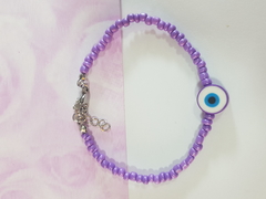 pulsera de mostacillas con bolitas y ojo turco de FIMO. Terminal de ACERO QUIRÚRGICO