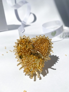Golden heart brooch
