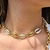 Choker Elos C/ Búzios Branco/Dourado na internet