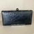 Bolsa clutch preta couro