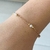 Pulseira infantil com perola e bolinhas banhada a ouro 18k - comprar online