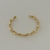 BRACELETE TORCIDO LISO FINO DOURADO